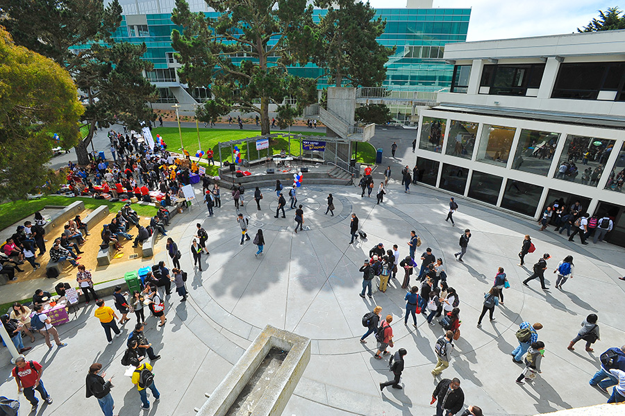 San Francisco State University students walking in front of Malcolm X Plaza.